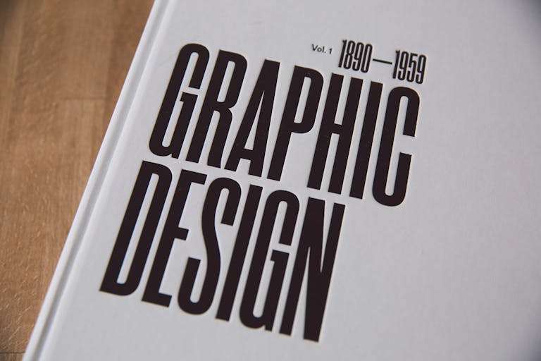 Close-up image of a graphic design book cover with bold text.